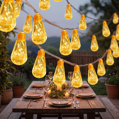 S14 solar cafe string lights over an outdoor dining table at dusk