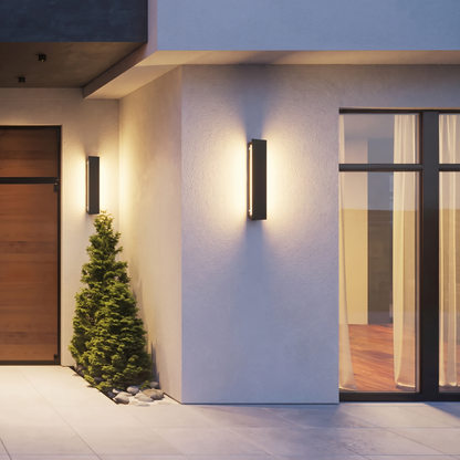 Linear outdoor wall light beside a front door at dusk