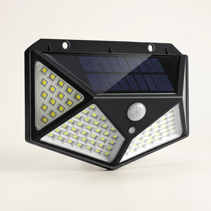 The solar floodlight on a plain background showing its panel and sensor