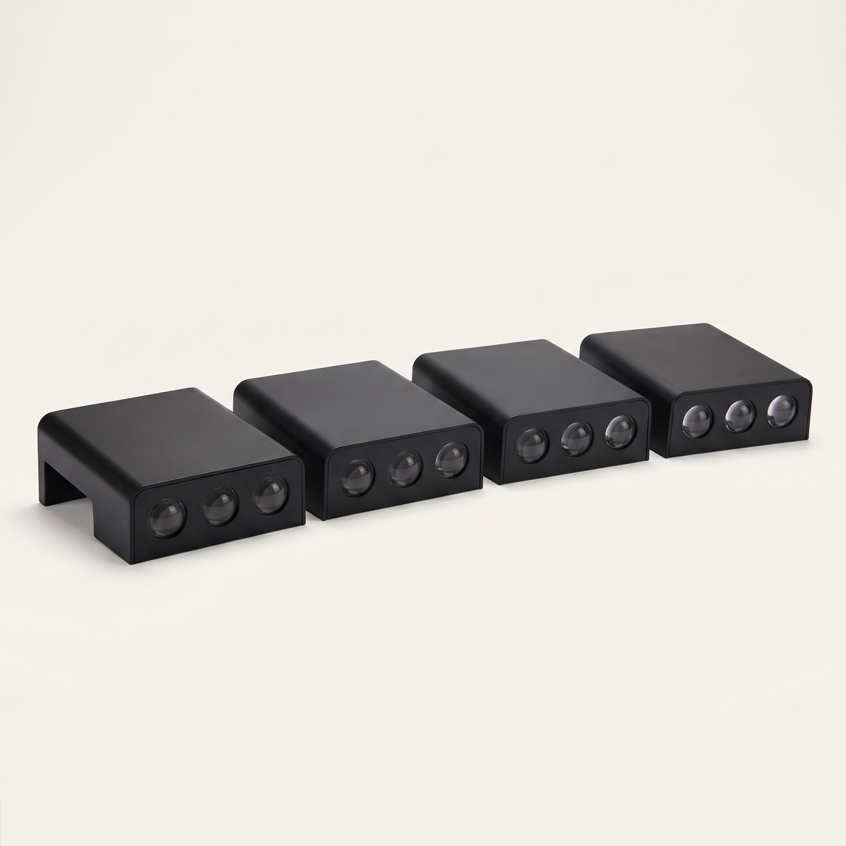 Four of the solar step lights on a plain background