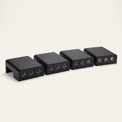 Four of the solar step lights on a plain background