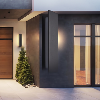The linear wall light mounted on a modern entrance in daylight