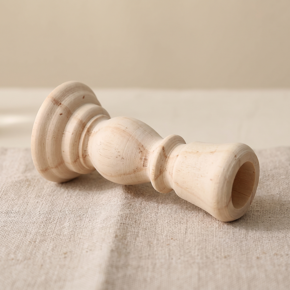Close view of the bare grain and turned rings of a small candlestick