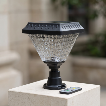 The solar post lantern unlit with its remote handset beside it
