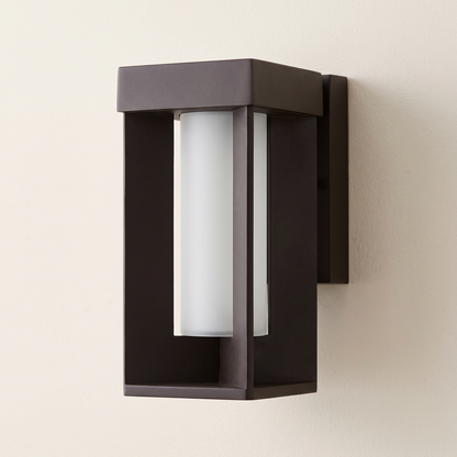 The framed lantern unlit showing its frame and frosted glass column