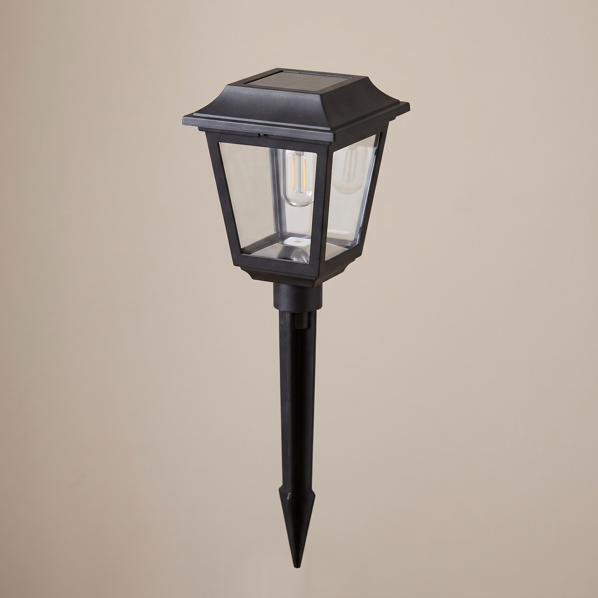 The solar path lantern unlit showing the lantern head and ground stake