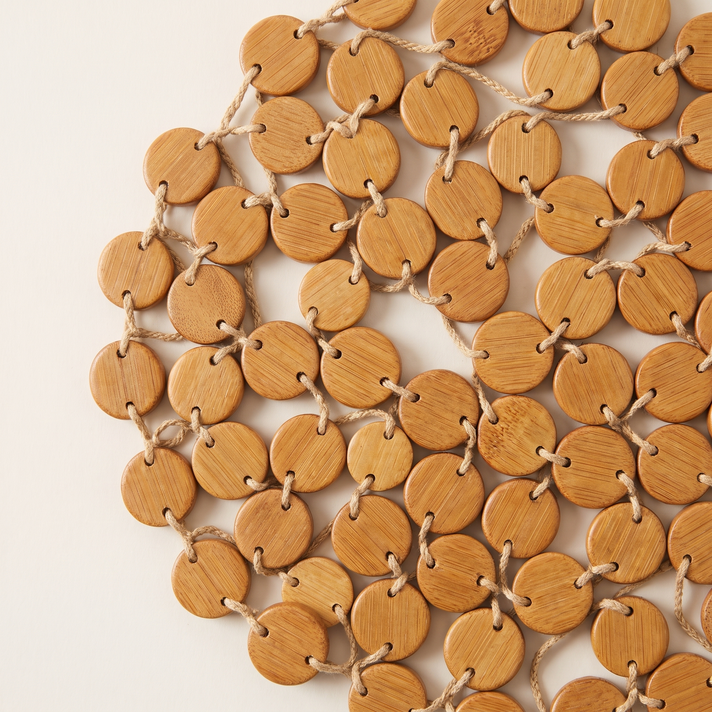 Close view of the bamboo discs threaded together